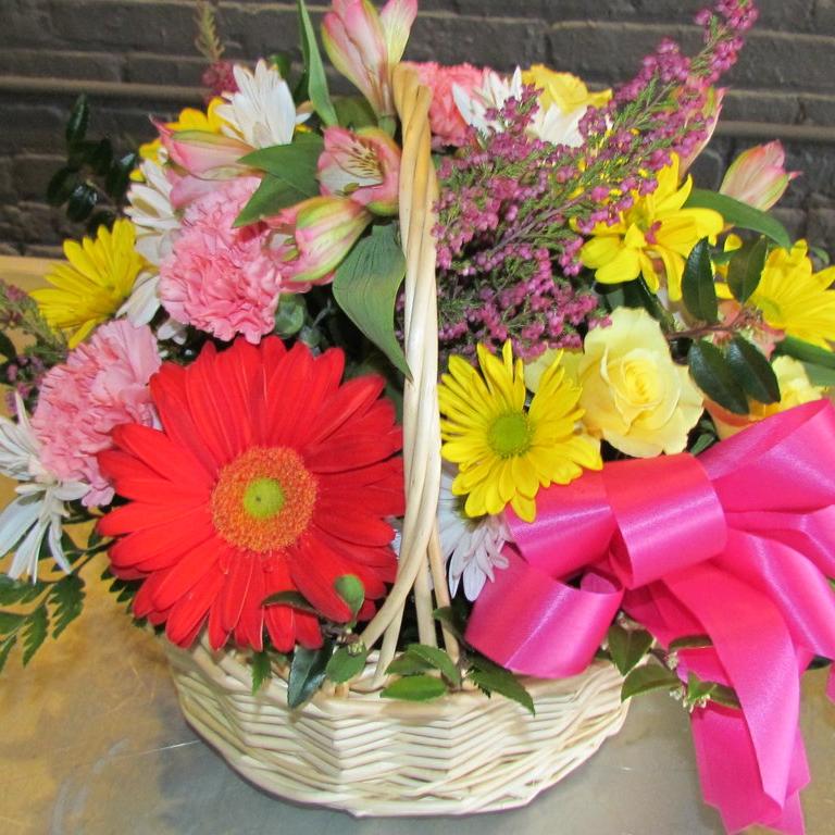 Basket full of bright colors with bows