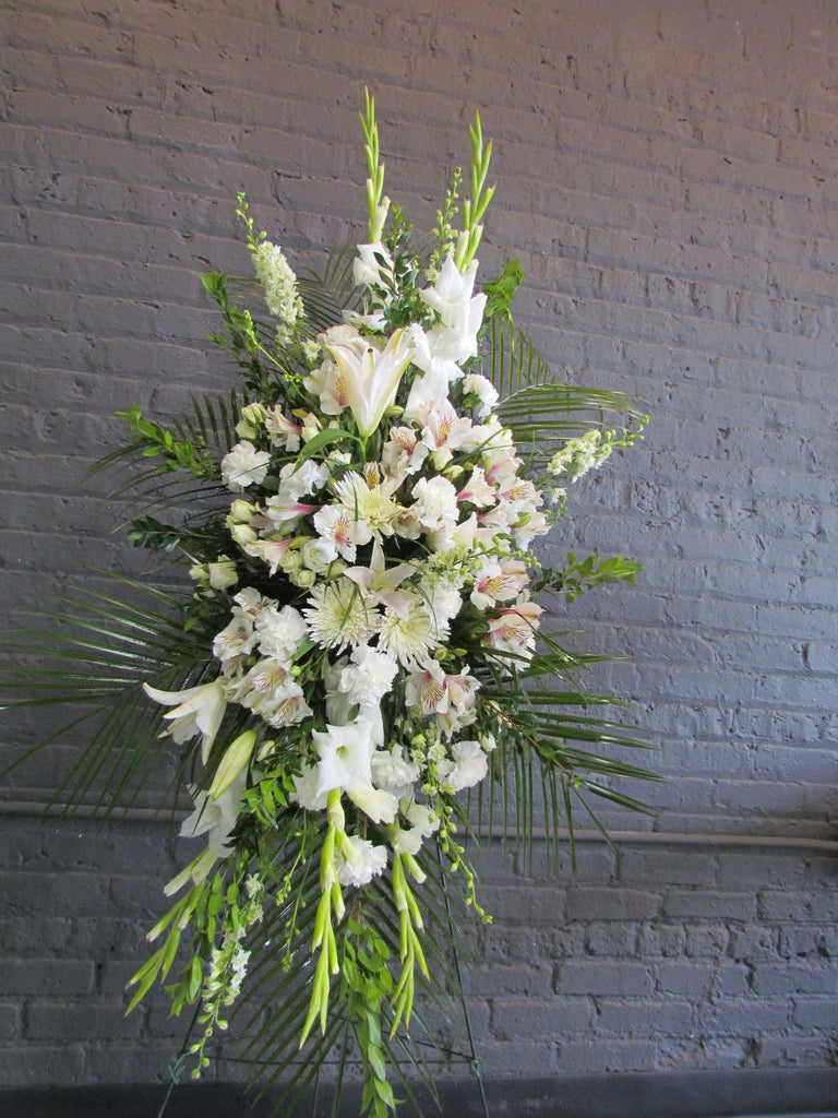 Funeral tribute spray in all white flowers